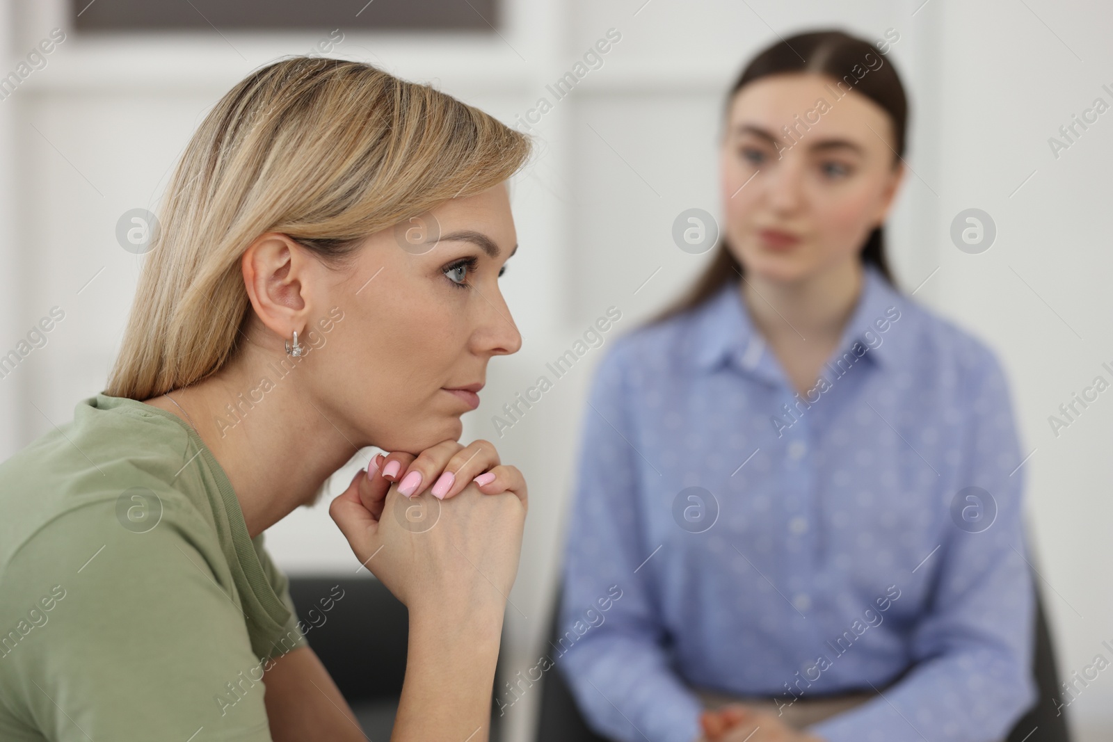 Photo of Psychotherapist working with military woman in office