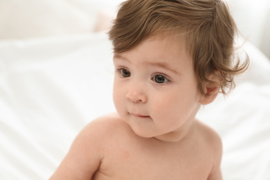 Adorable little baby on bed. Cute child