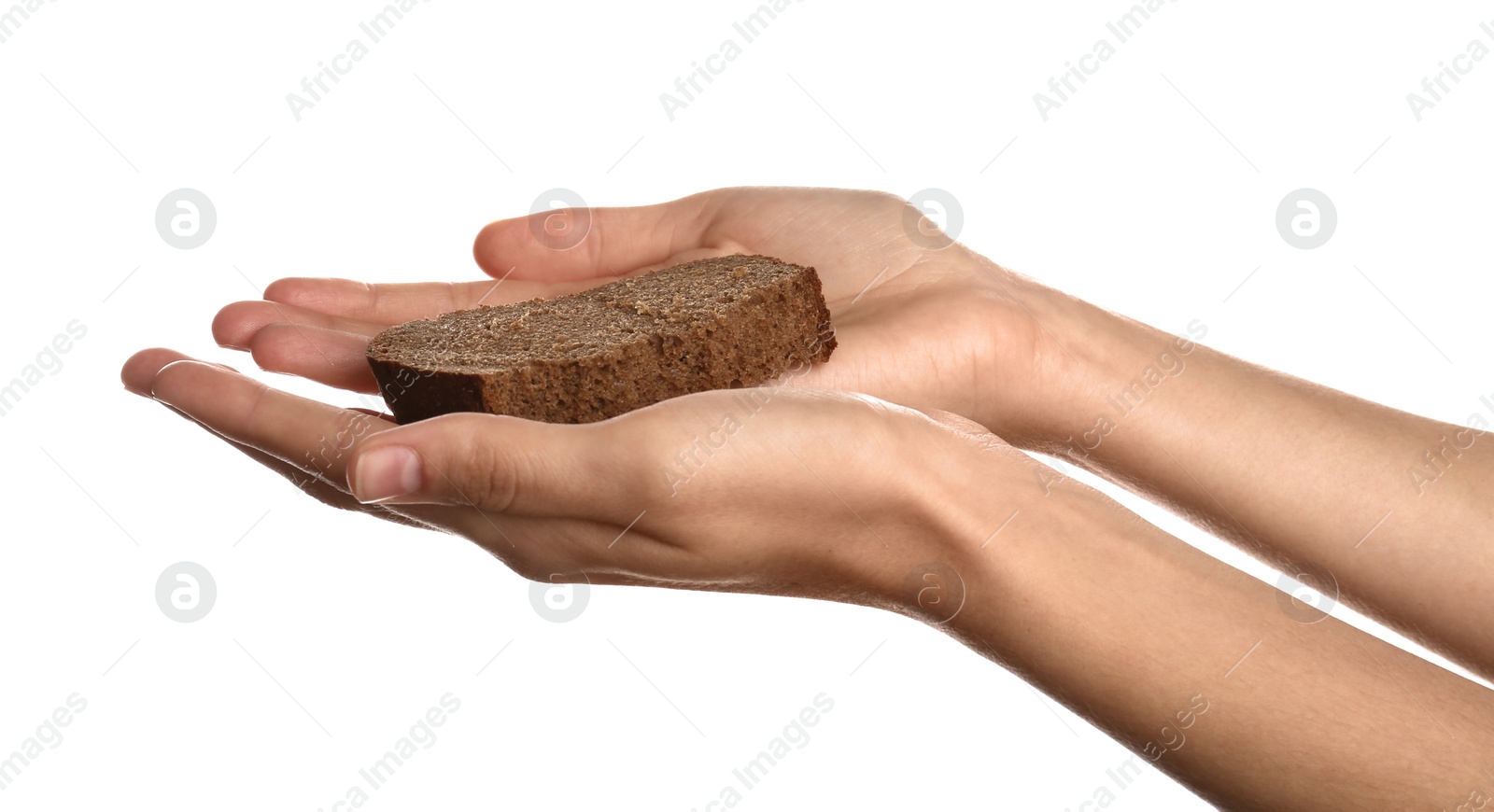 Photo of Poor woman holding piece of bread on white background, closeup