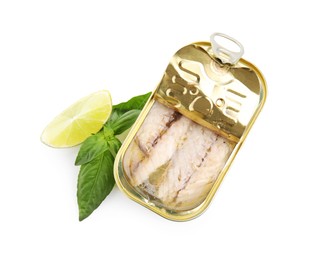 Photo of Open tin can with mackerel fillets, lime and basil on white background, top view
