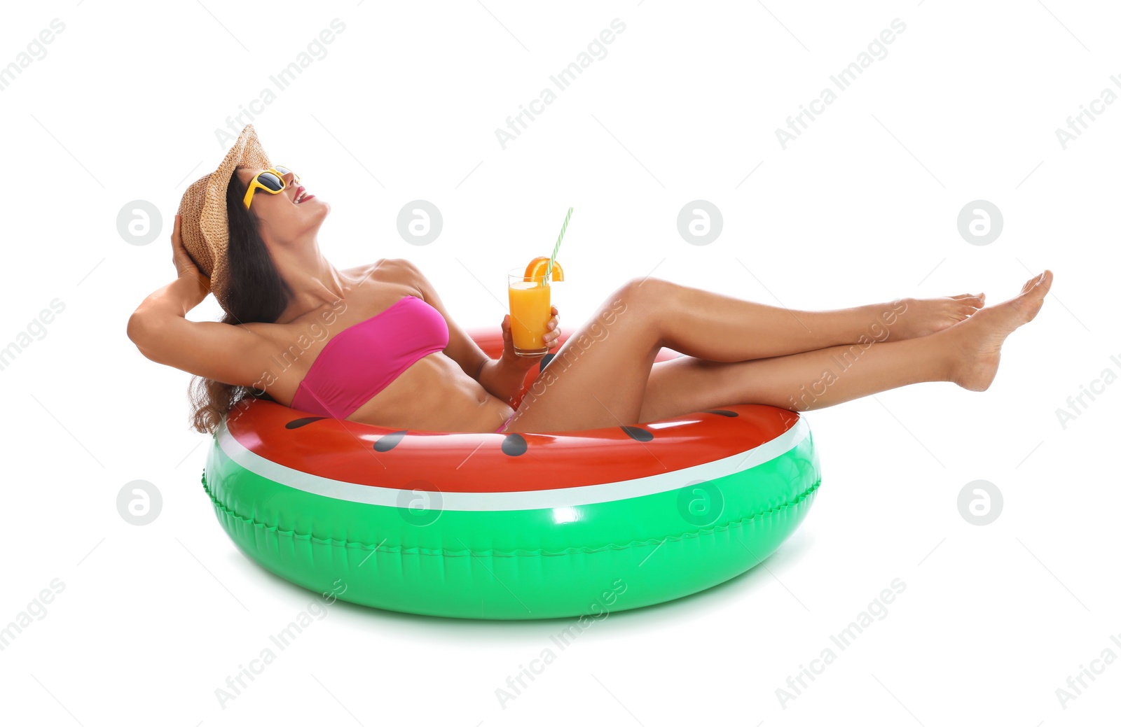 Photo of Beautiful young woman with inflatable ring and glass of cocktail on white background