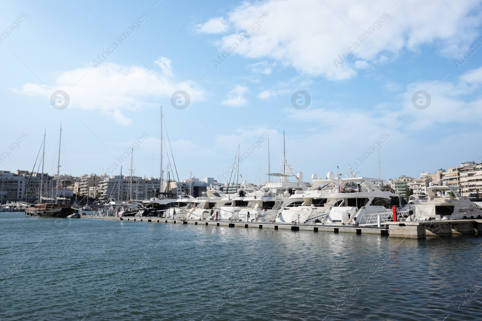 Photo of Picturesque view of port with modern boats on sunny day