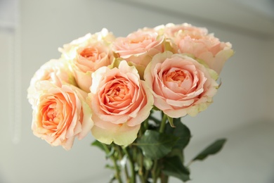 Photo of Bouquet of beautiful pink roses indoors, closeup