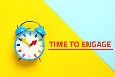Image of Alarm clock and phrase TIME TO ENGAGE on color background, top view