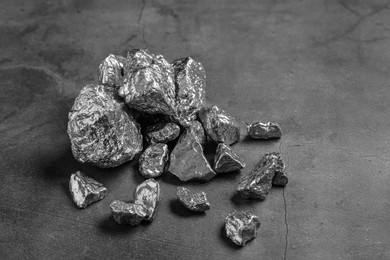 Pile of silver nuggets on grey table