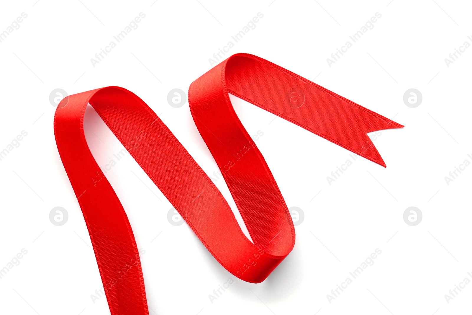 Photo of Simple red ribbon on white background, top view