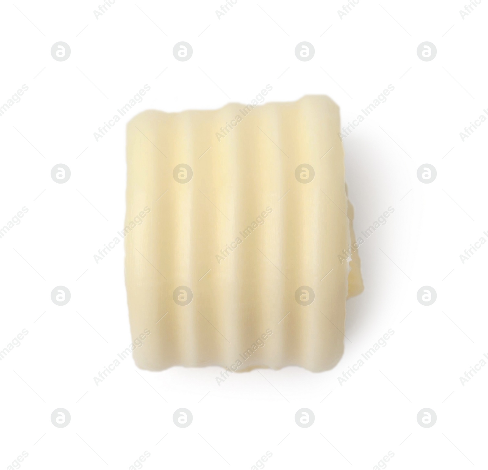 Photo of One tasty butter curl isolated on white, top view