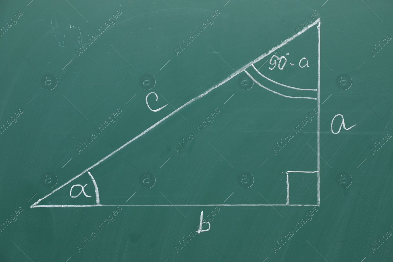 Photo of Triangle and geometry task on green board