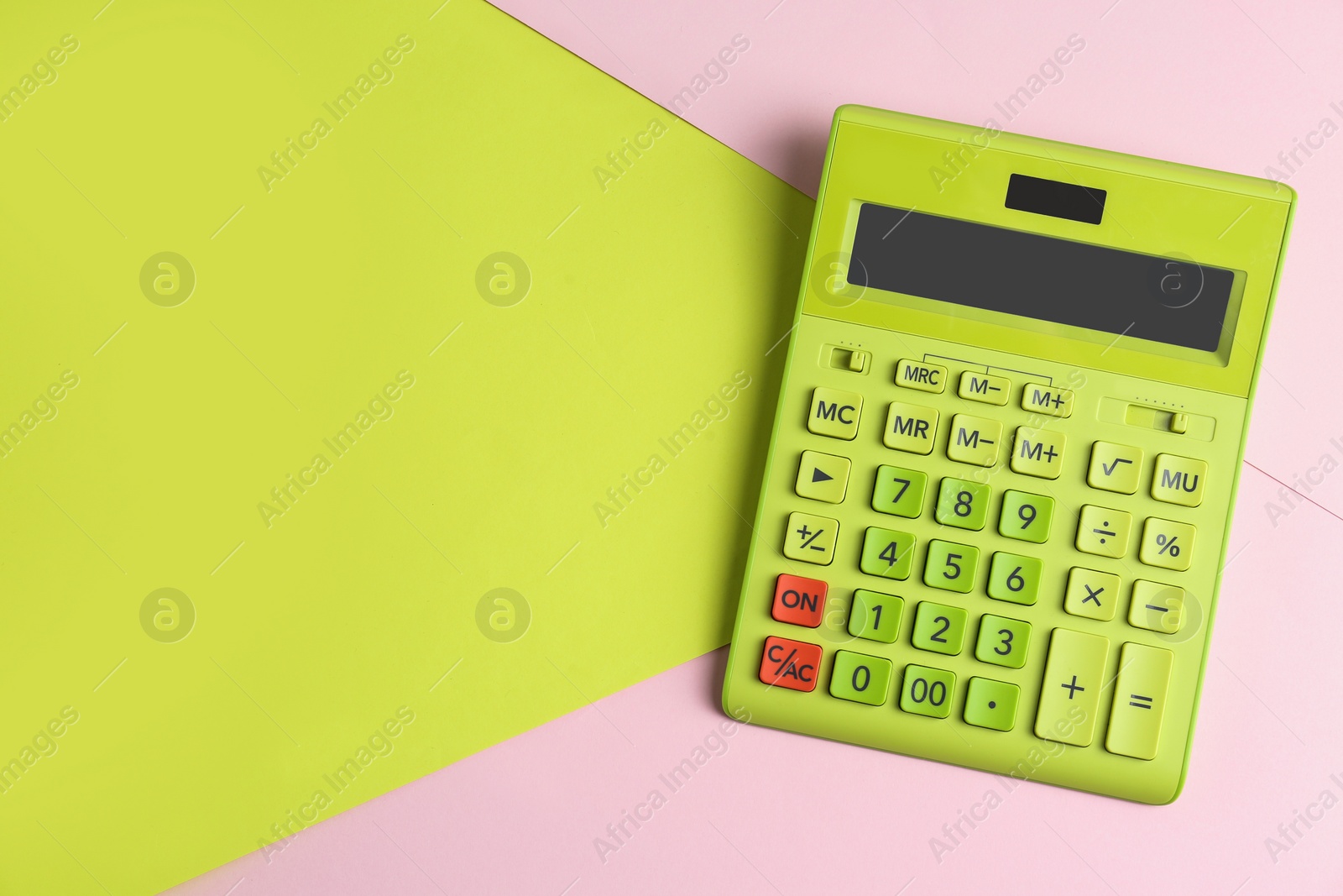 Photo of Modern calculator on color background, top view. Space for text