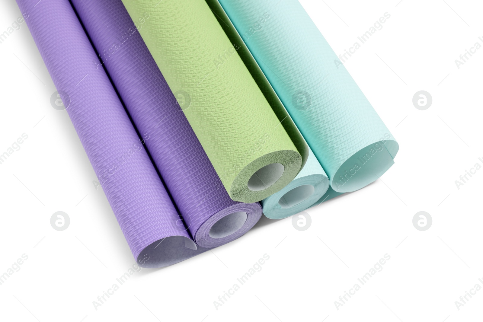 Photo of Three colorful wallpaper rolls isolated on white