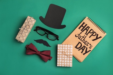 Photo of Flat lay composition with bow tie, gift boxes and paper decor on color background. Happy Father's Day