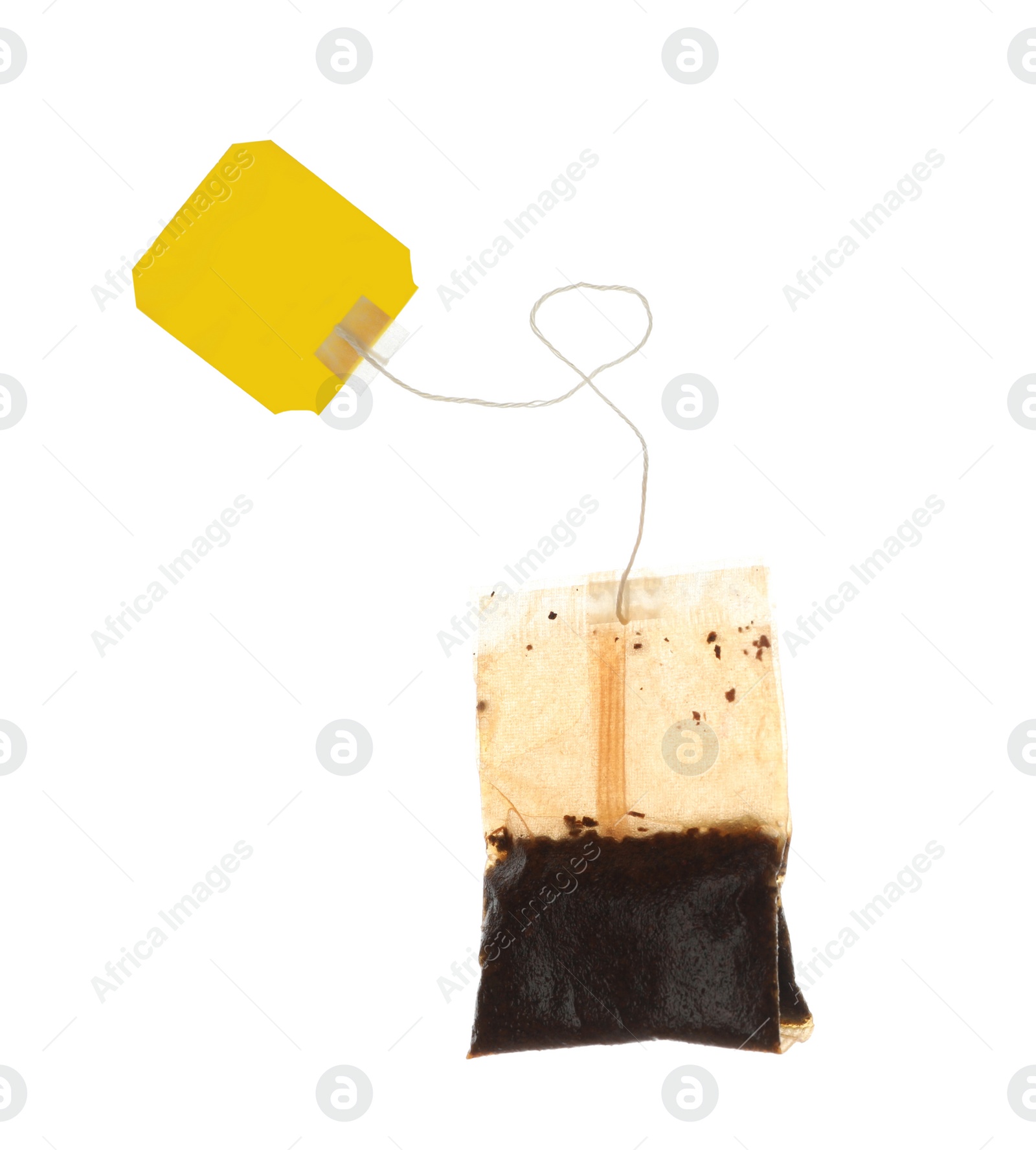 Photo of Used tea bag with tag isolated on white