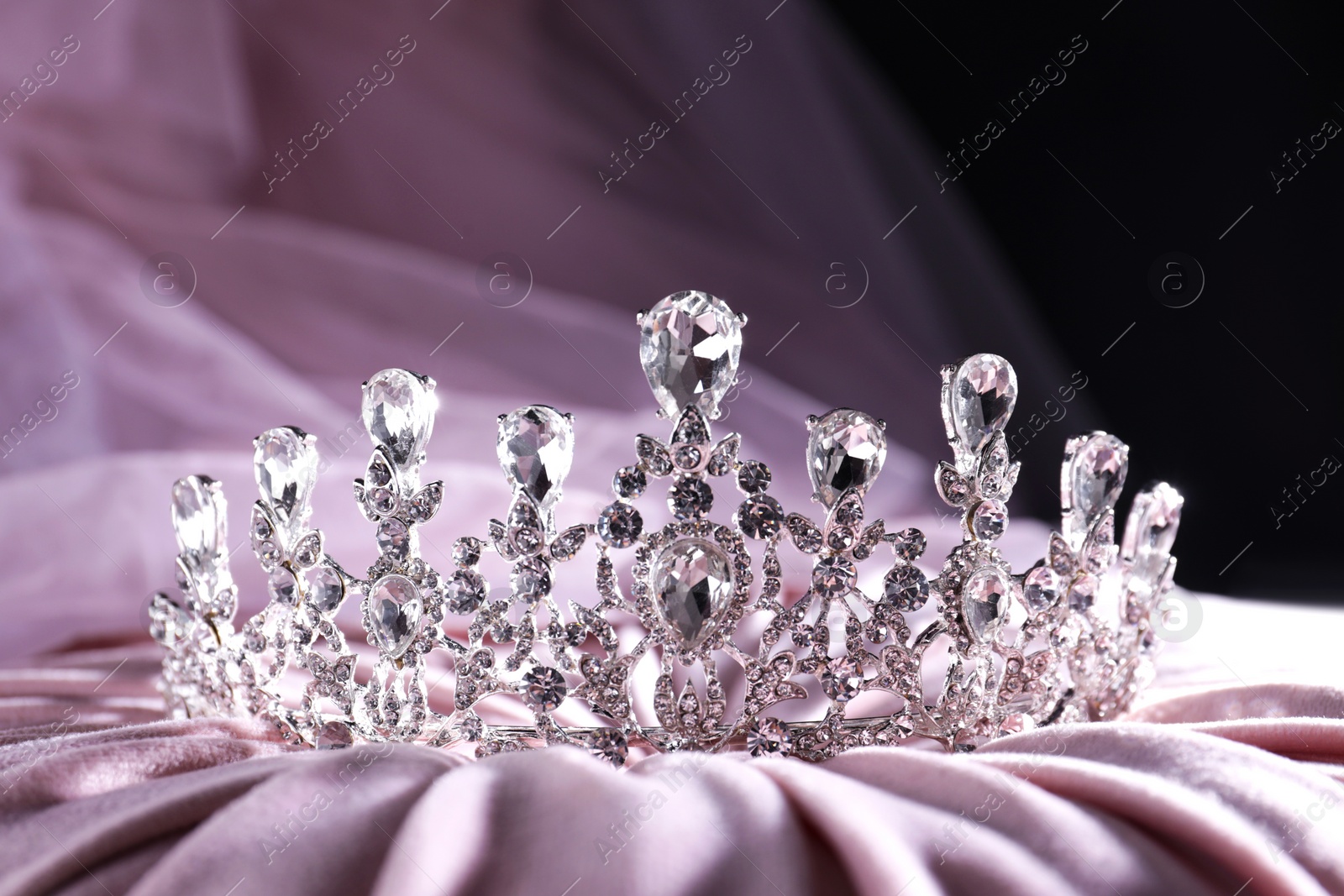 Photo of Beautiful silver tiara with diamonds on light cloth