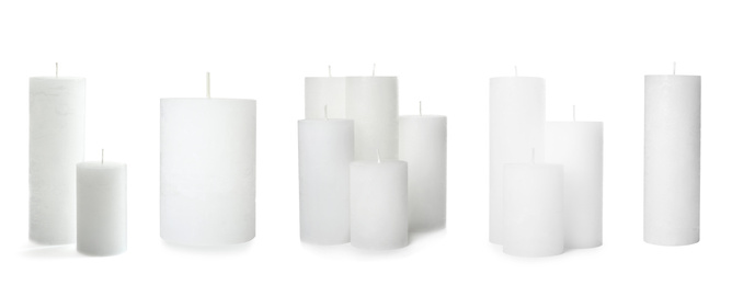 Image of Set of wax candles on white background. Banner design