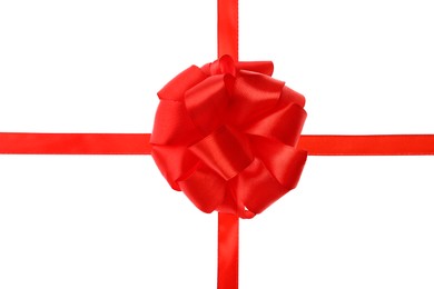 Photo of Red ribbon with bow on white background. Festive decoration