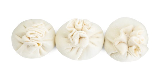 Photo of Uncooked khinkali (dumplings) isolated on white, top view. Georgian cuisine