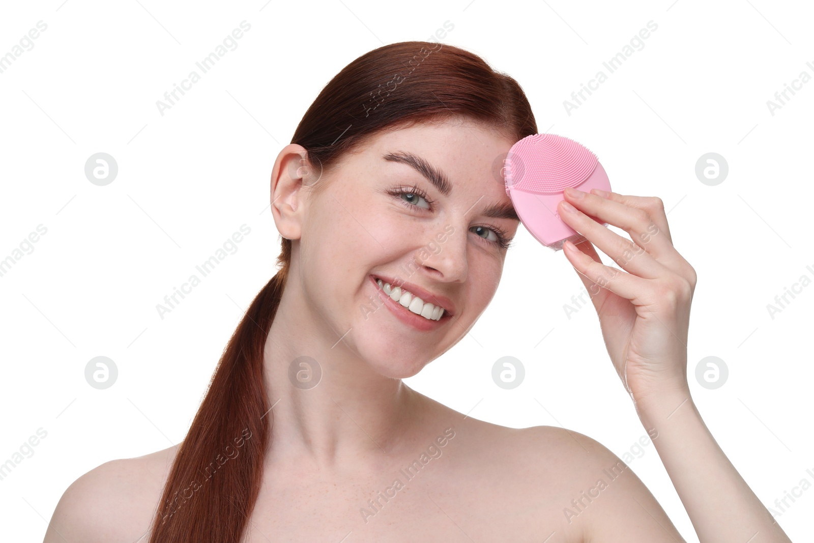 Photo of Washing face. Young woman with cleansing brush on white background