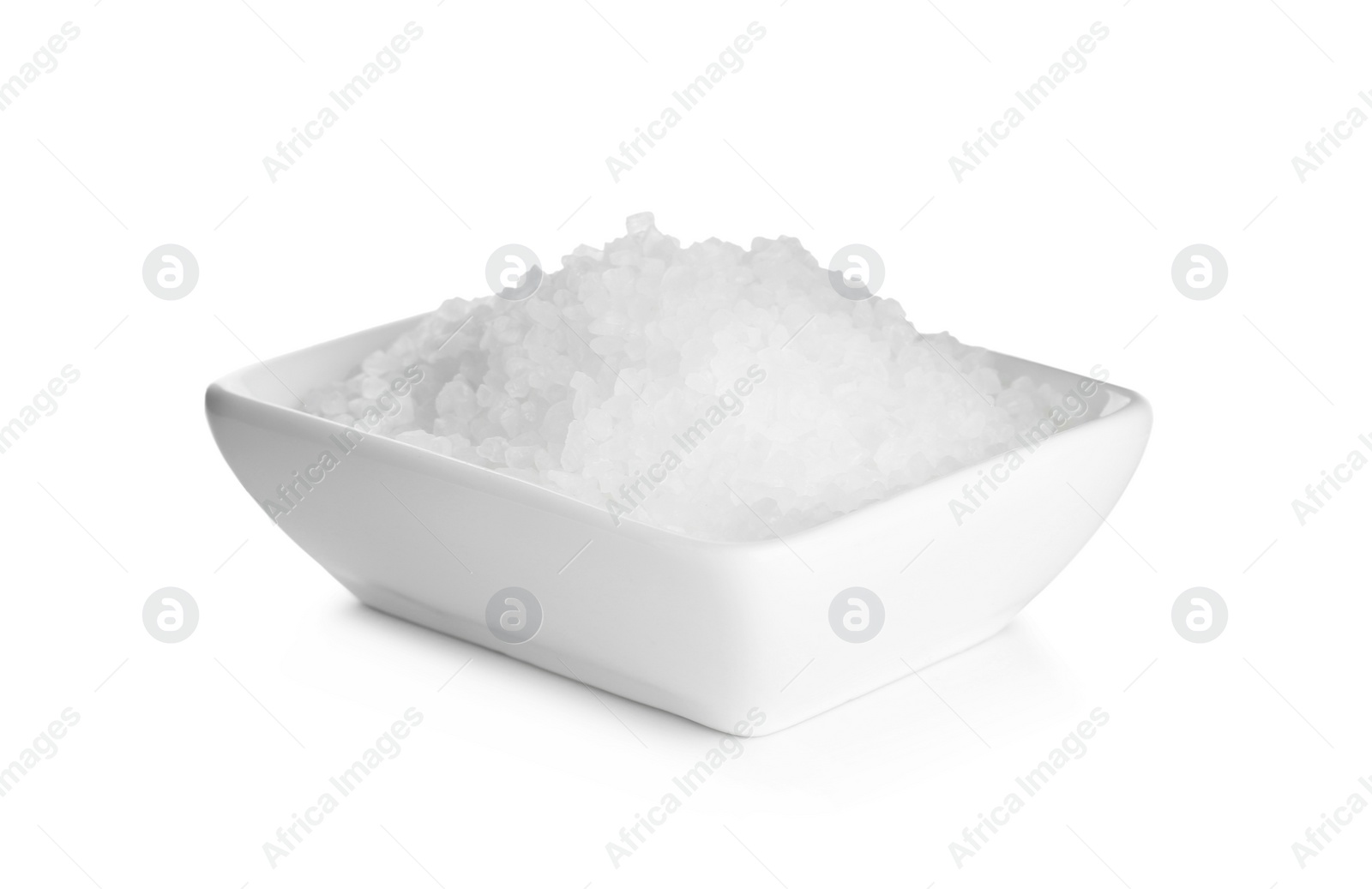 Photo of Natural salt in bowl isolated on white