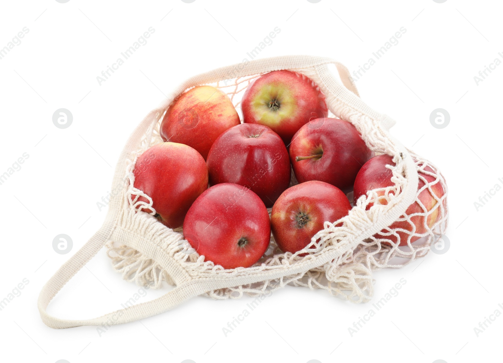 Photo of String bag with apples isolated on white