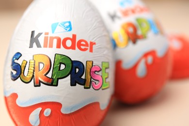 Slynchev Bryag, Bulgaria - May 25, 2023: Kinder Surprise Eggs on blurred background, closeup. Space for text