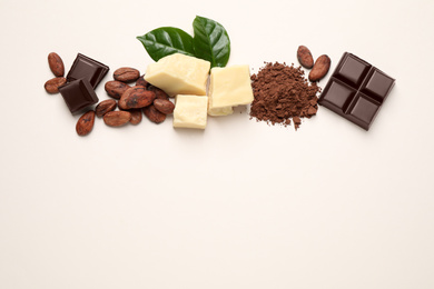 Photo of Flat lay composition with organic cocoa butter on beige background. Space for text