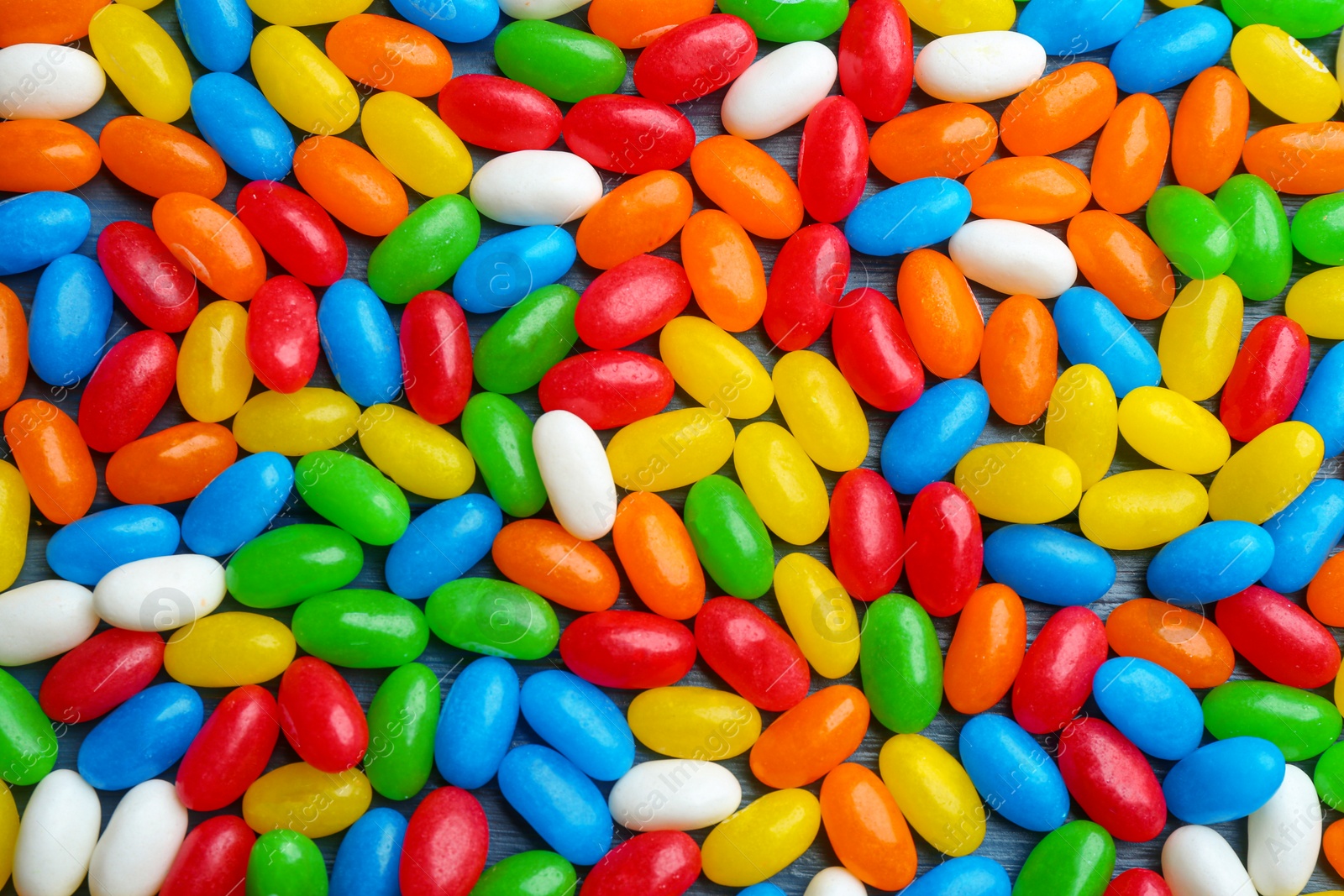 Photo of Colorful jelly beans as background, top view