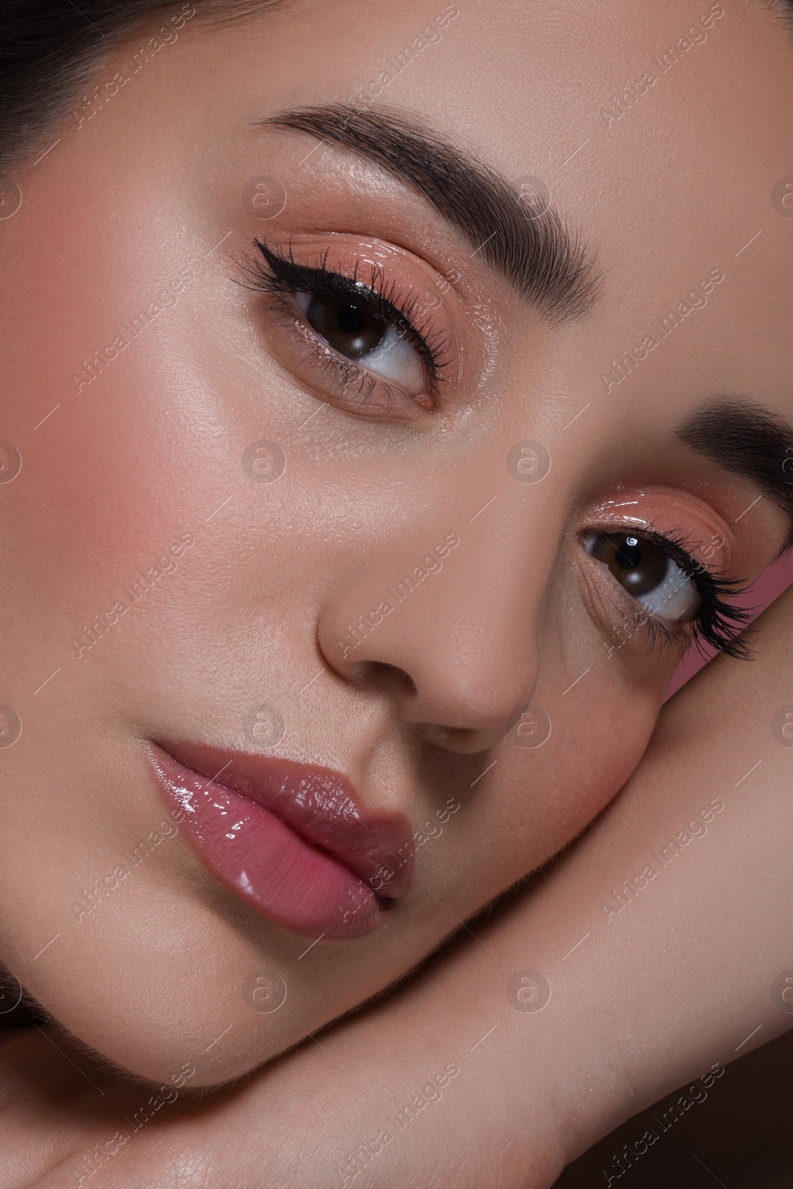 Photo of Portrait of beautiful young woman with perfect makeup, closeup