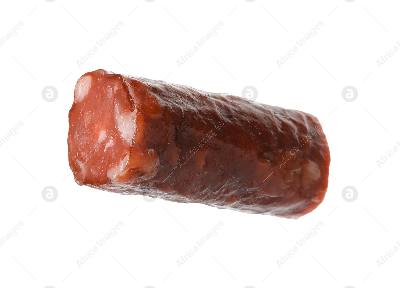 Photo of Piece of thin dry smoked sausage isolated on white