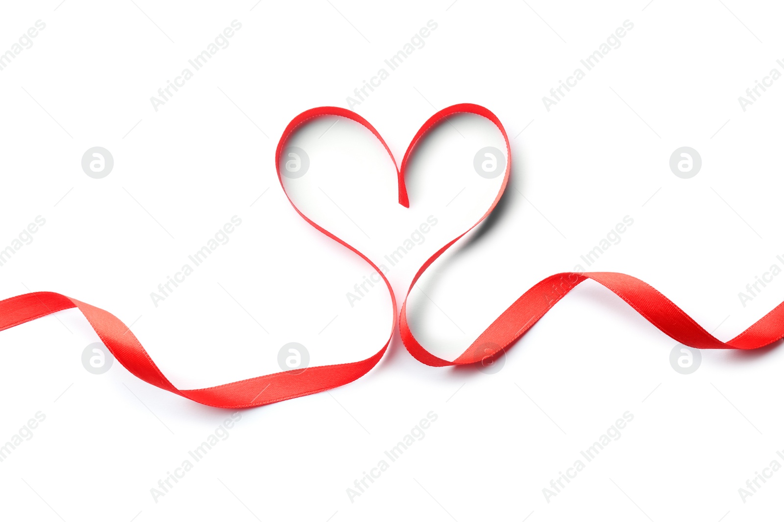 Photo of Heart made of red ribbon on white background, top view. Festive decoration