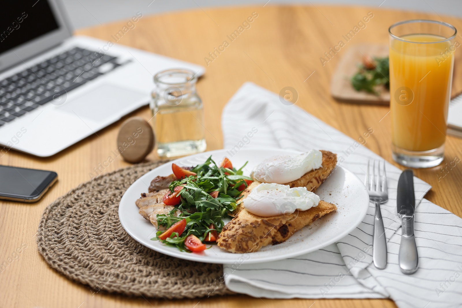 Photo of Delicious lunch served on table with laptop. Food blog