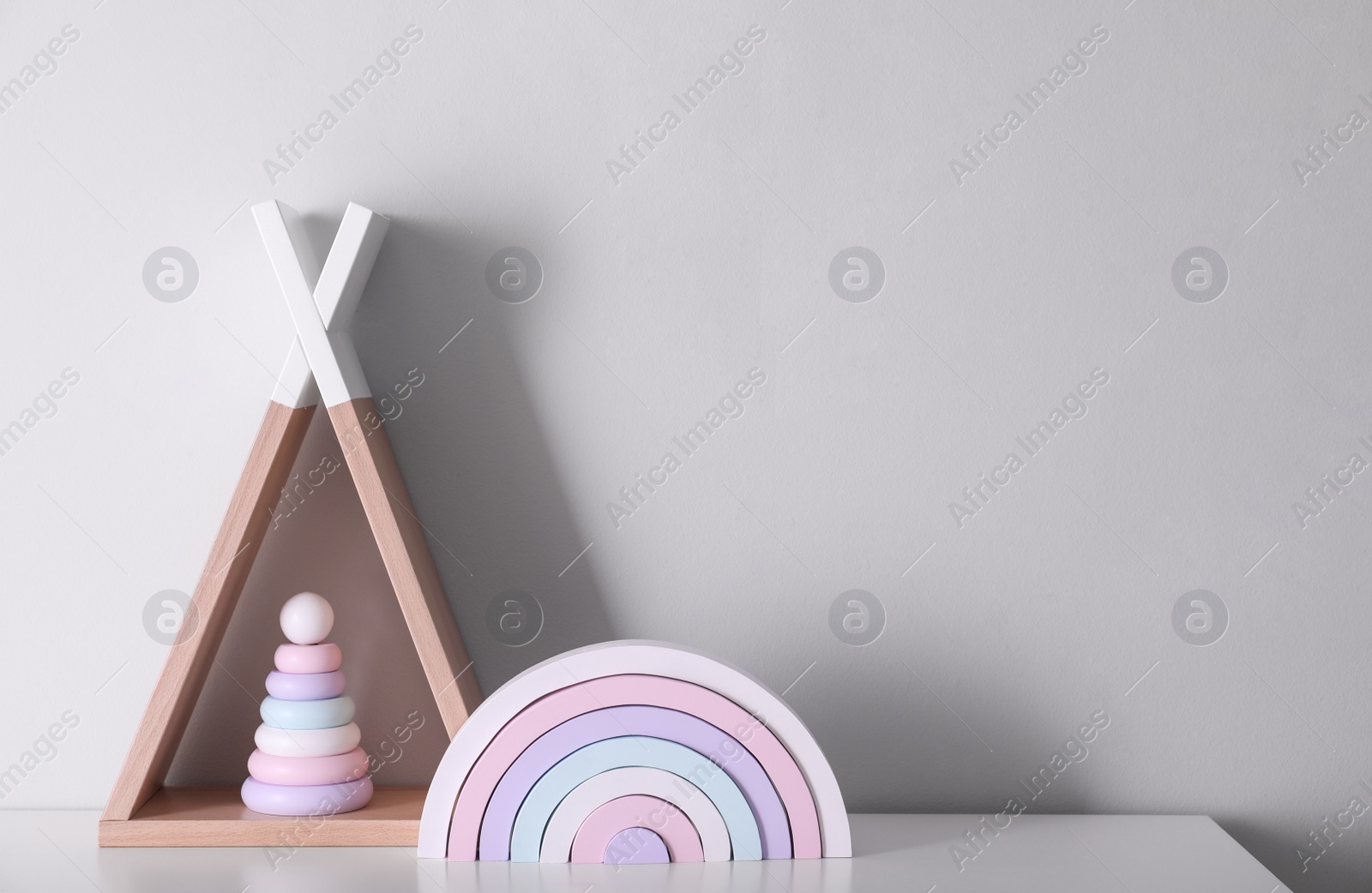 Photo of Cute toys on table, space for text. Interior design