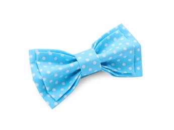 Stylish light blue bow tie with polka dot pattern on white background