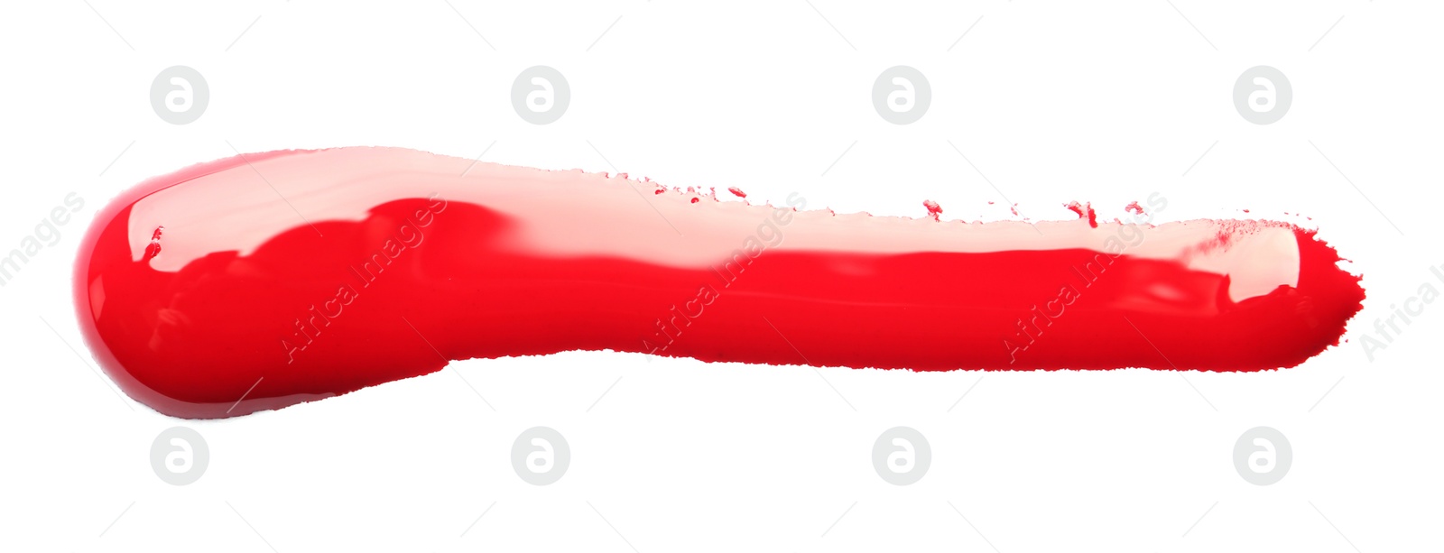 Photo of Abstract brushstroke of red paint isolated on white