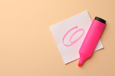 Photo of Bright pink marker and sticky note on beige background, flat lay. Space for text