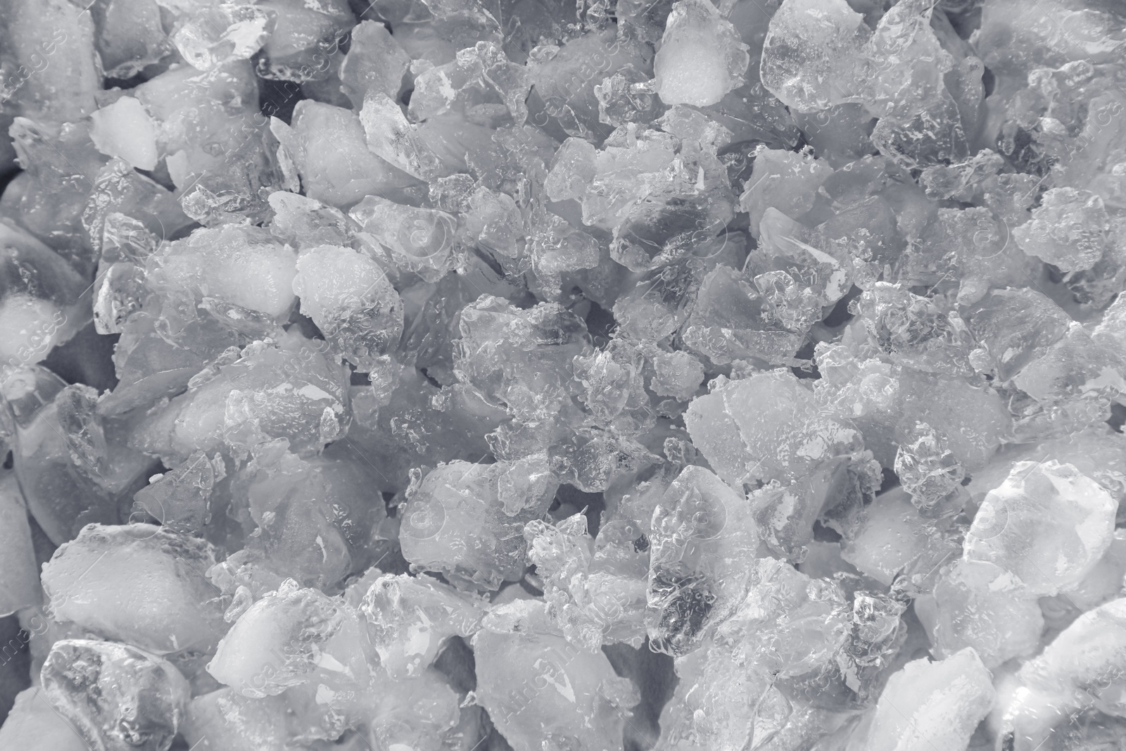 Photo of Clear crushed ice as background, closeup view