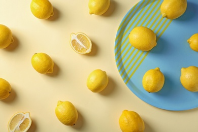 Photo of Flat lay composition with ripe lemons on color background