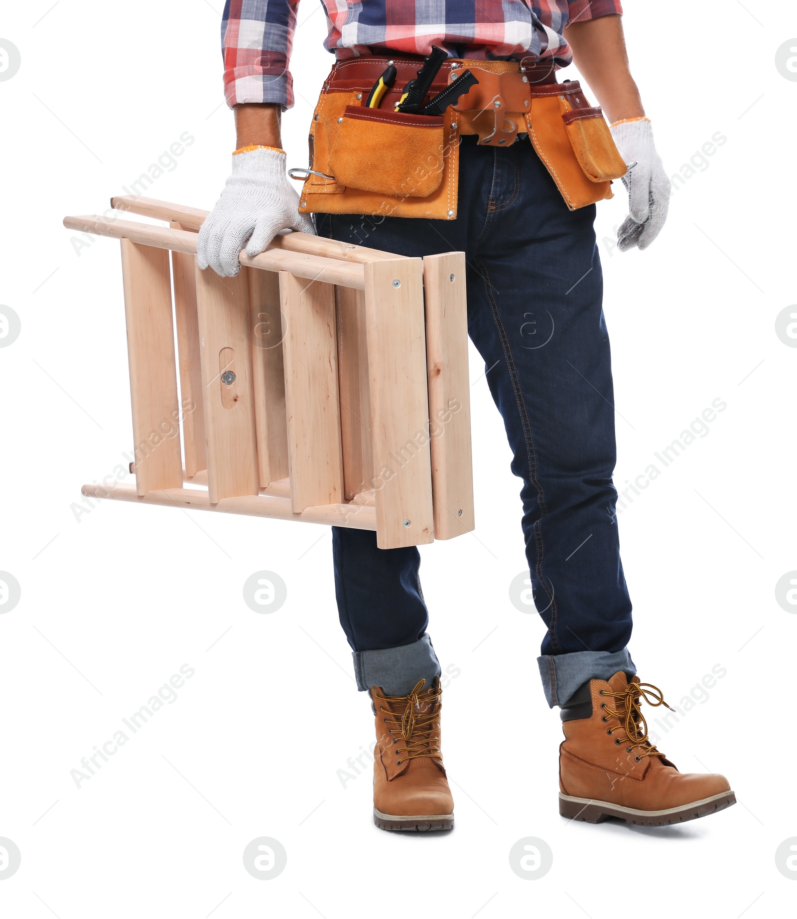 Photo of Professional constructor with wooden ladder on white background, closeup
