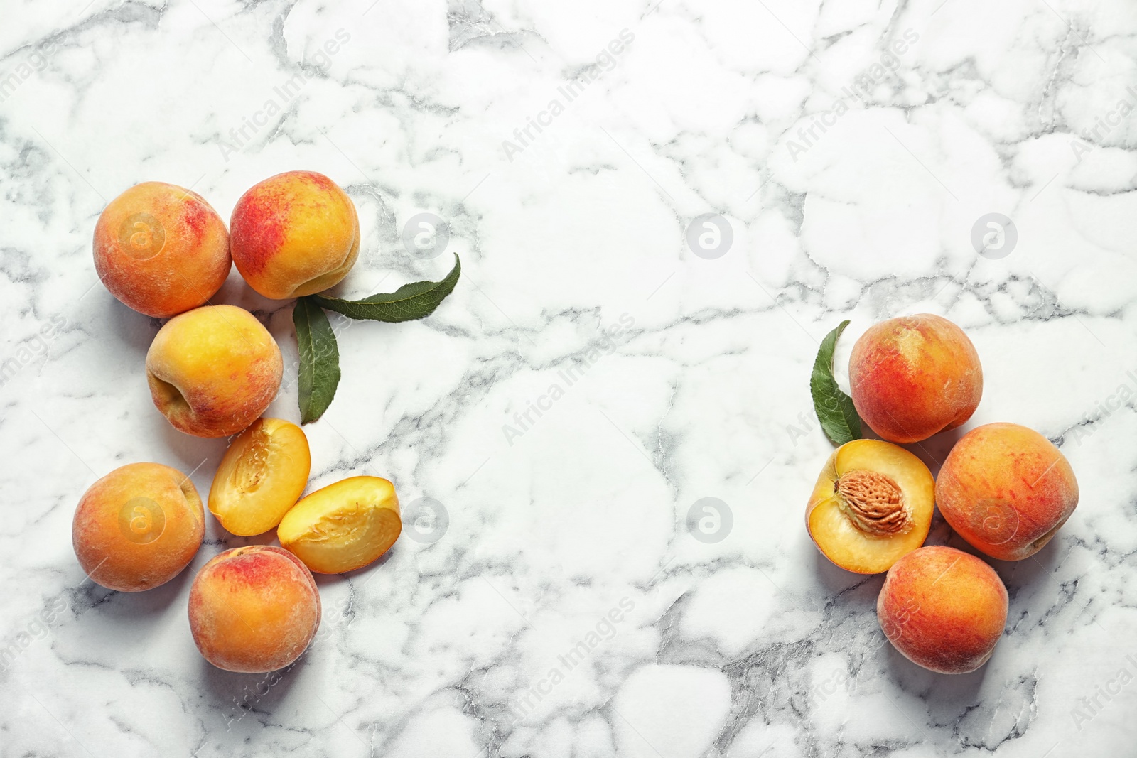 Photo of Flat lay composition with ripe peaches on marble background