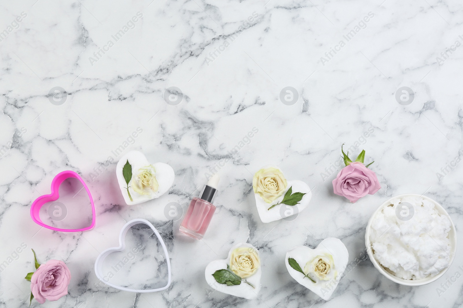 Photo of Flat lay composition with natural handmade soap on white marble table, space for text