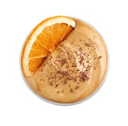 Glass of delicious dalgona coffee with dry orange and chocolate isolated on white, top view