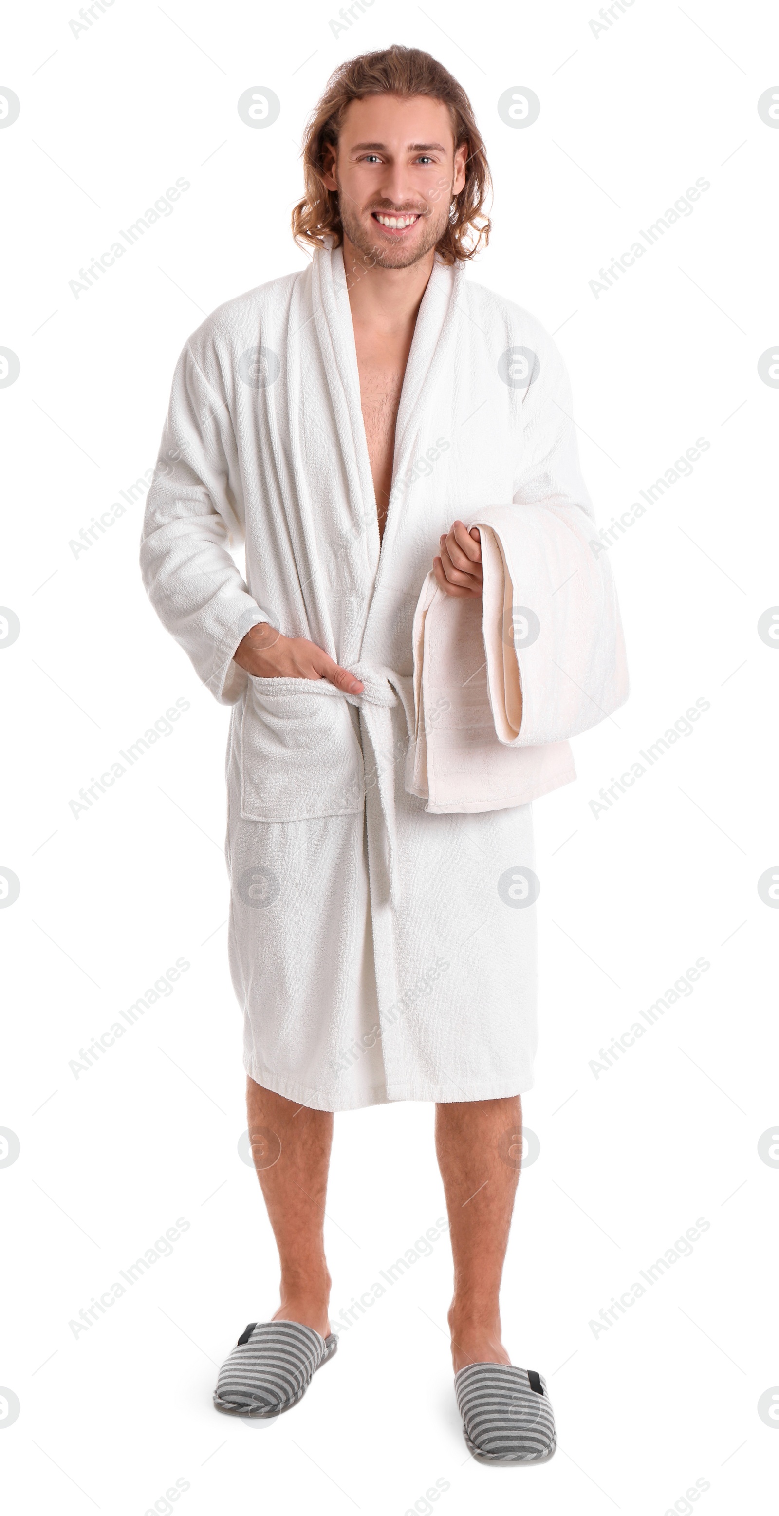 Photo of Young man in bathrobe with towel on white background