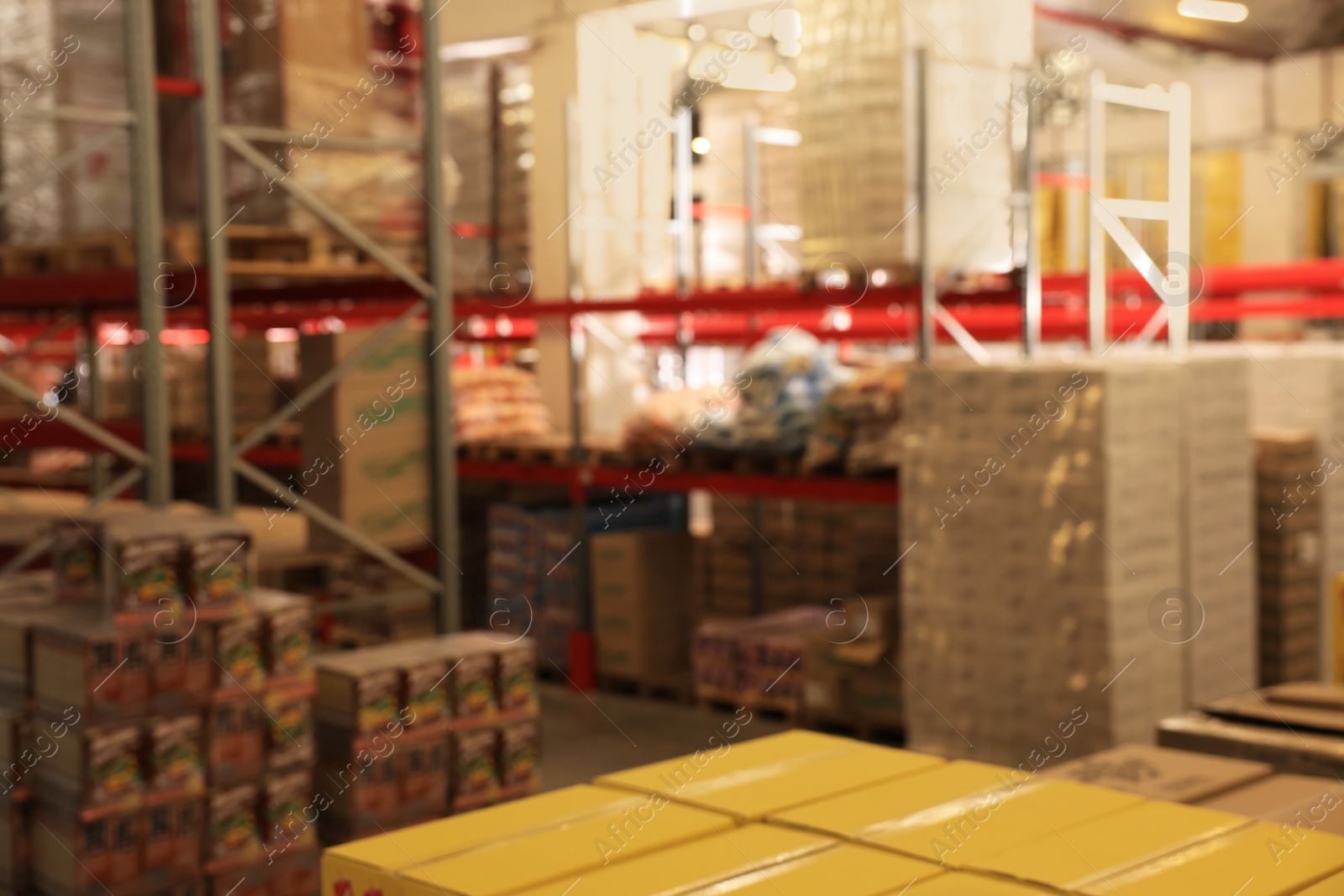 Image of Warehouse with lots of products, blurred view. Wholesale business