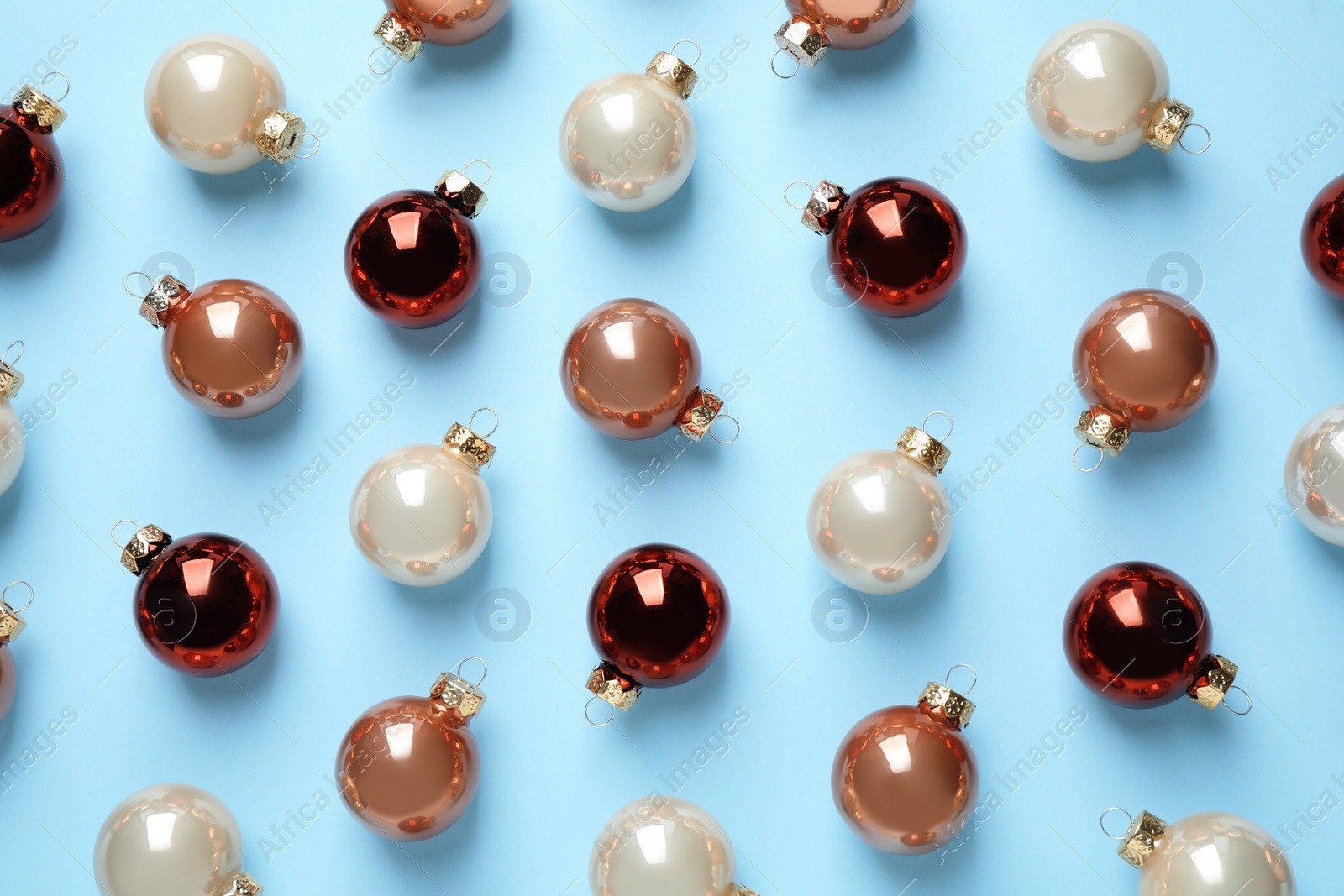 Photo of Flat lay composition with Christmas decorations on light blue background