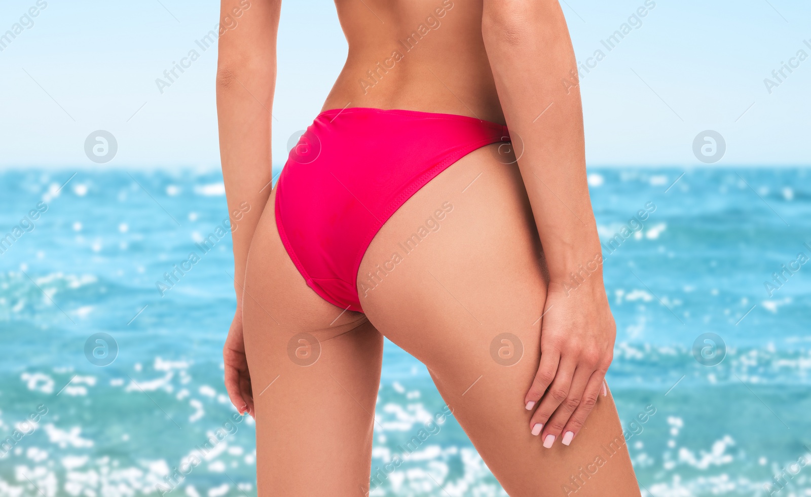 Image of Woman in stylish pink bikini near sea, closeup