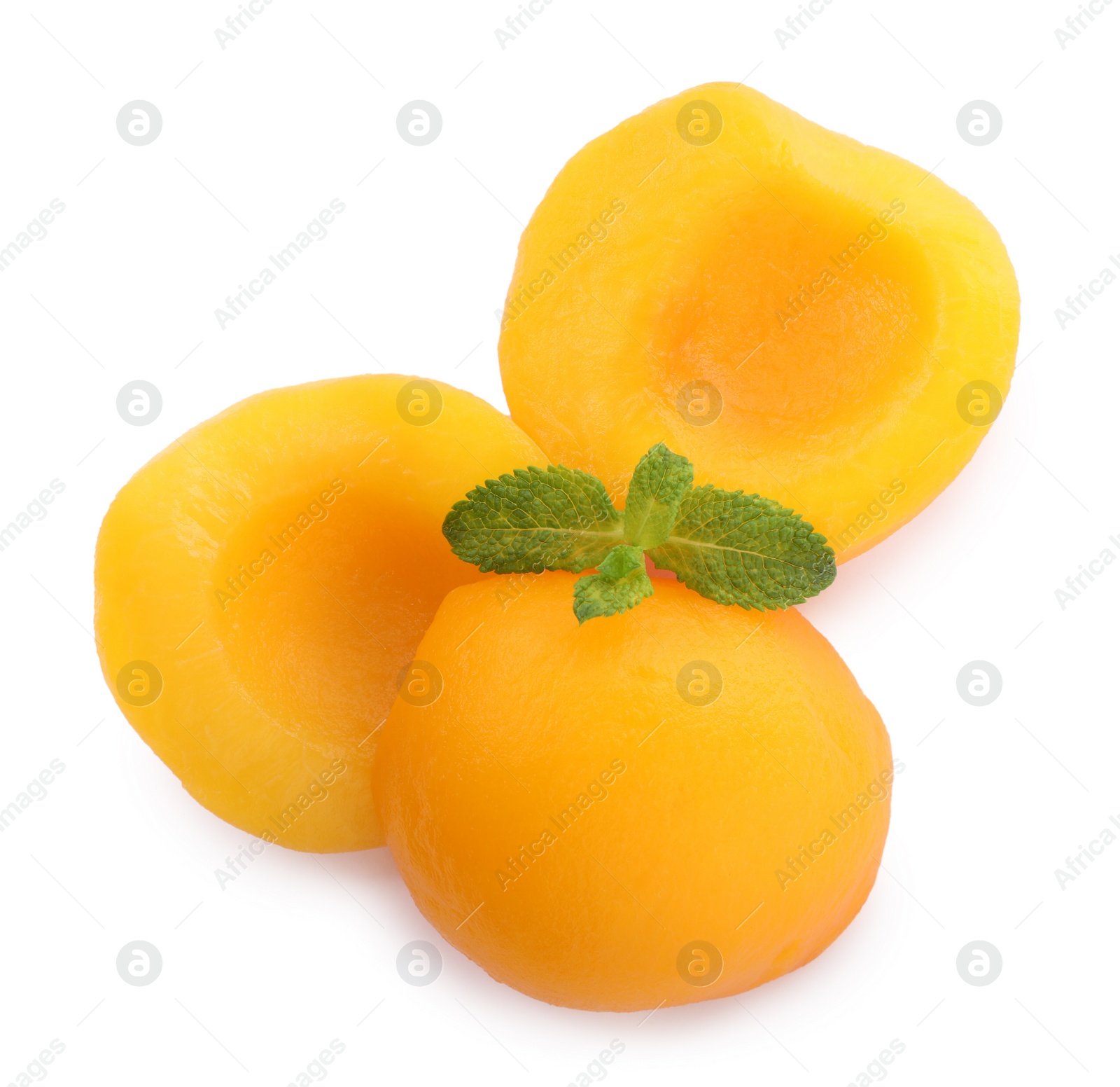 Photo of Sweet canned peach halves with mint isolated on white, top view