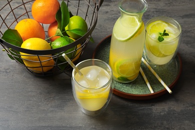 Photo of Composition with fresh lemonade on table