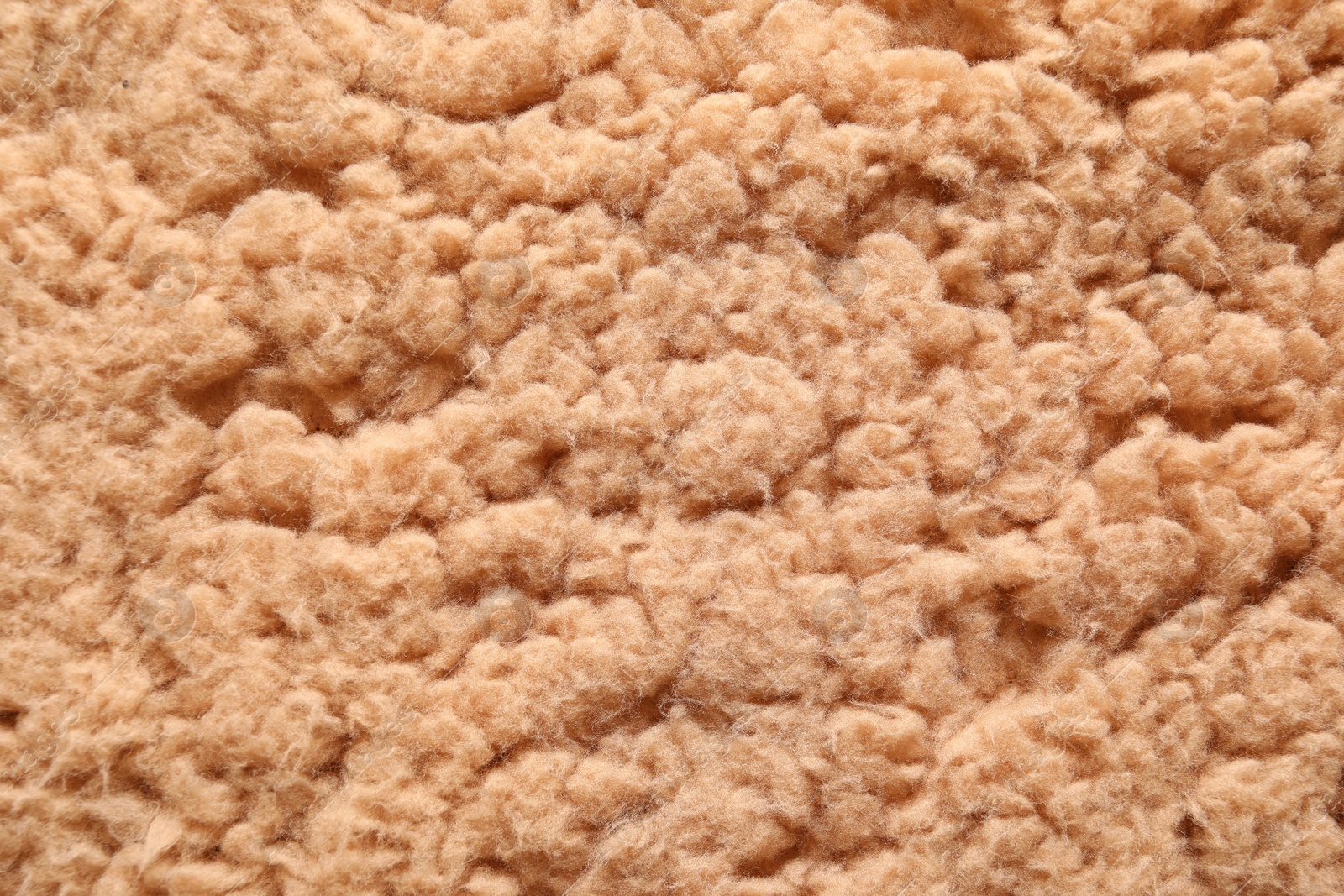 Photo of Texture of brown faux fur as background, top view