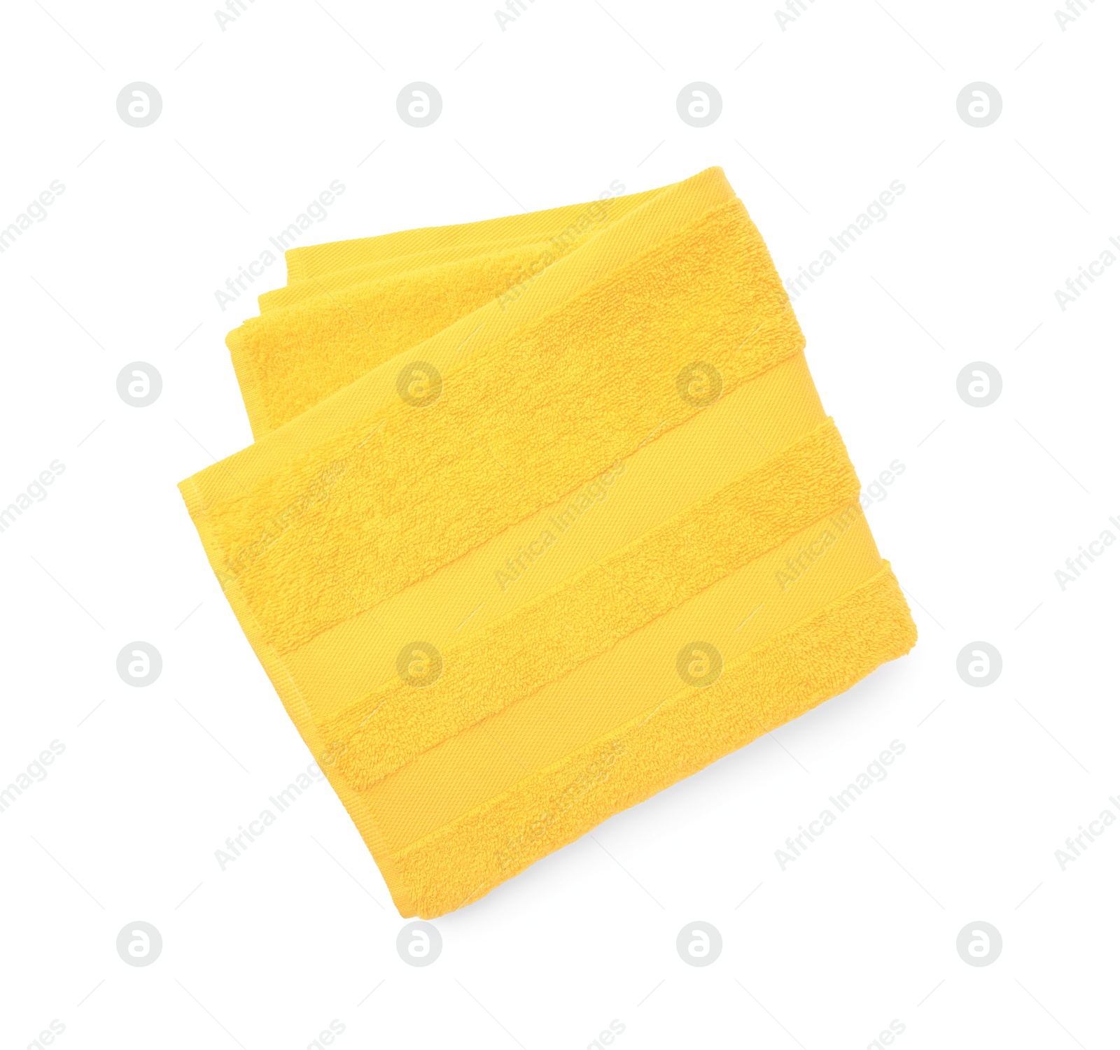 Photo of Soft yellow terry towel isolated on white, top view