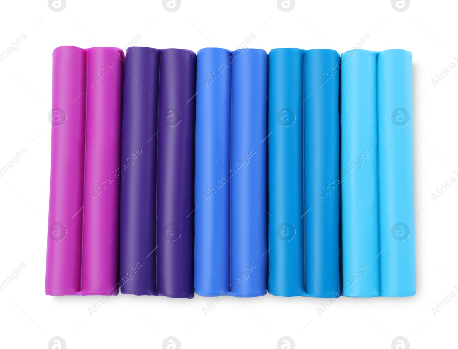 Photo of Many different colorful plasticine pieces on white background, top view