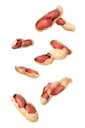 Image of Many peanuts in air on white background